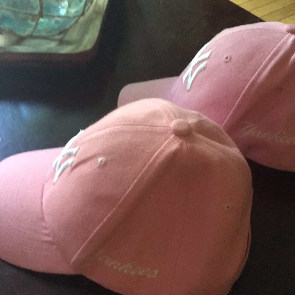 2 Women’s Yankee caps.